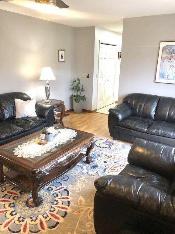 266 River Road Sunderland, MA 01375 - Photo 6 of 38 a bedroom with a bed window and a couch
