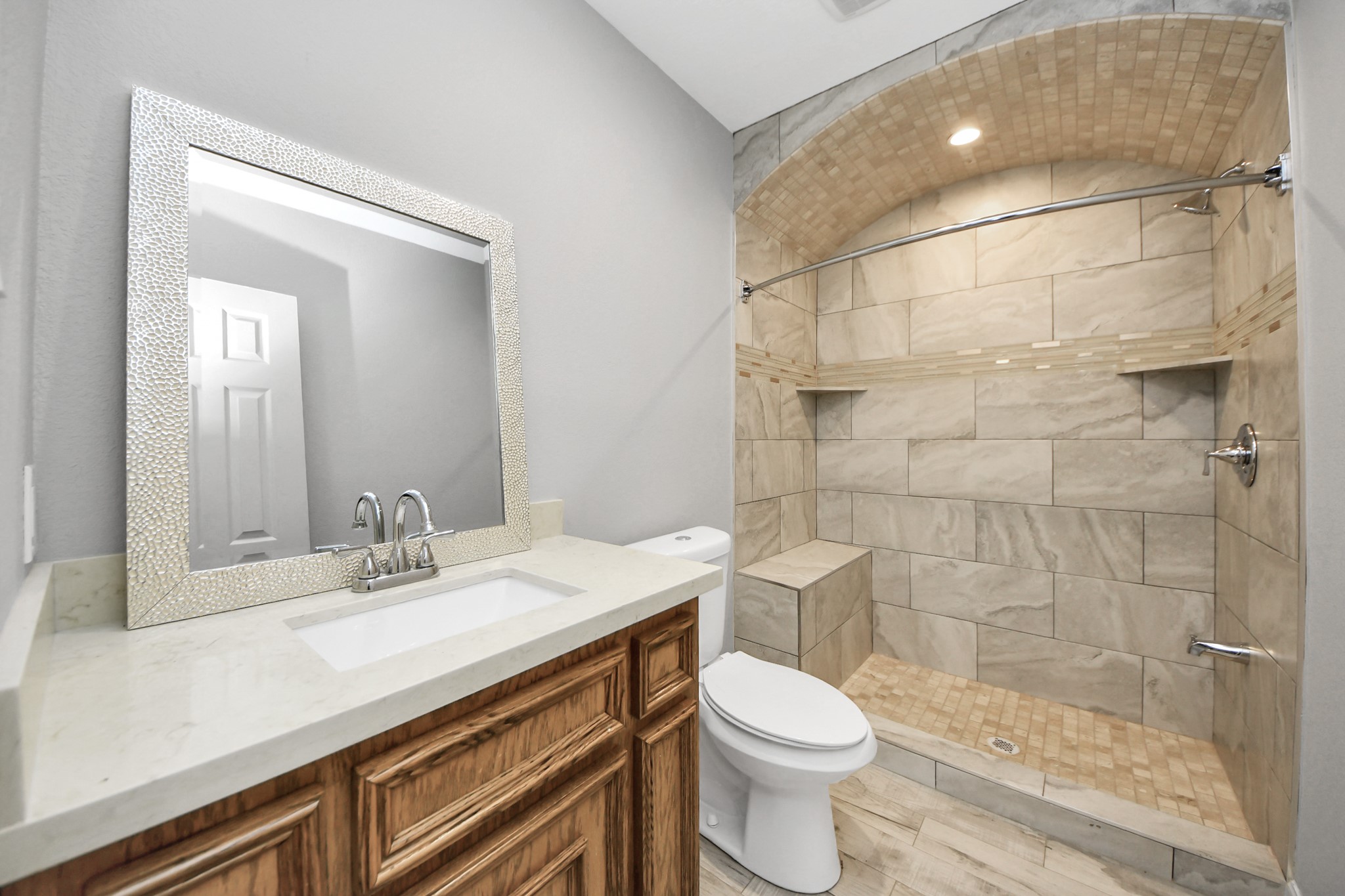 8925 Homewood Lane Houston, TX 77078 - Photo 17 of 28 a bathroom with a sink a toilet and shower