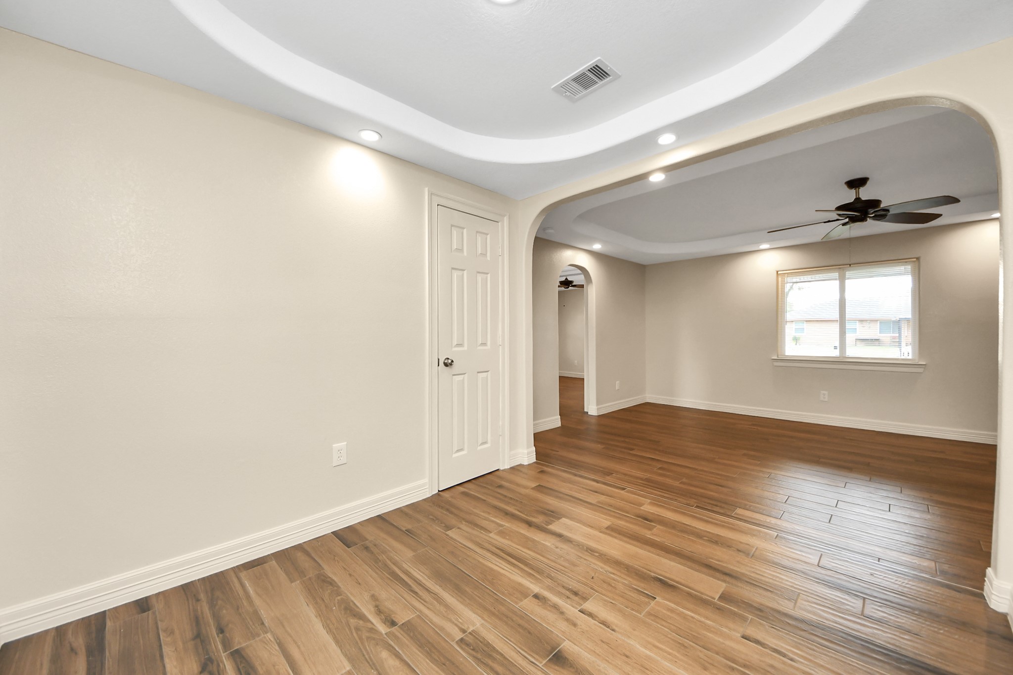 8925 Homewood Lane Houston, TX 77078 - Photo 8 of 28 a view of empty room with wooden floor