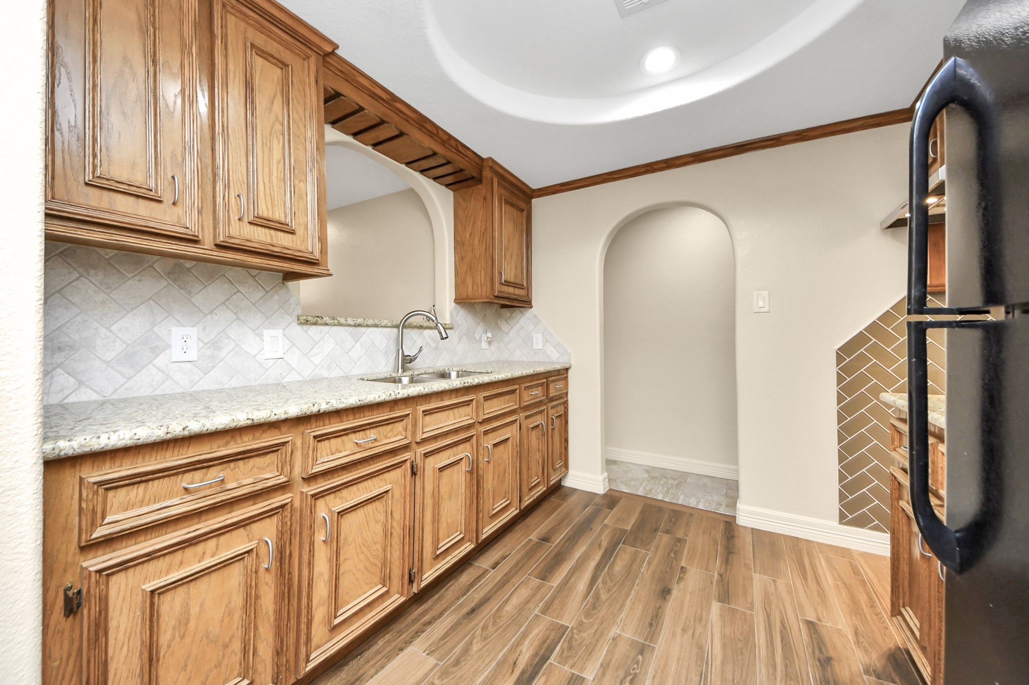 8925 Homewood Lane Houston, TX 77078 - Photo 9 of 28 a spacious bathroom with a granite countertop sink and a mirror