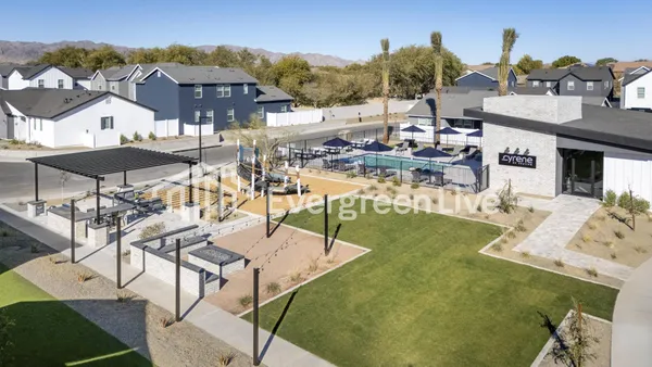 a view of a house with yard and porch