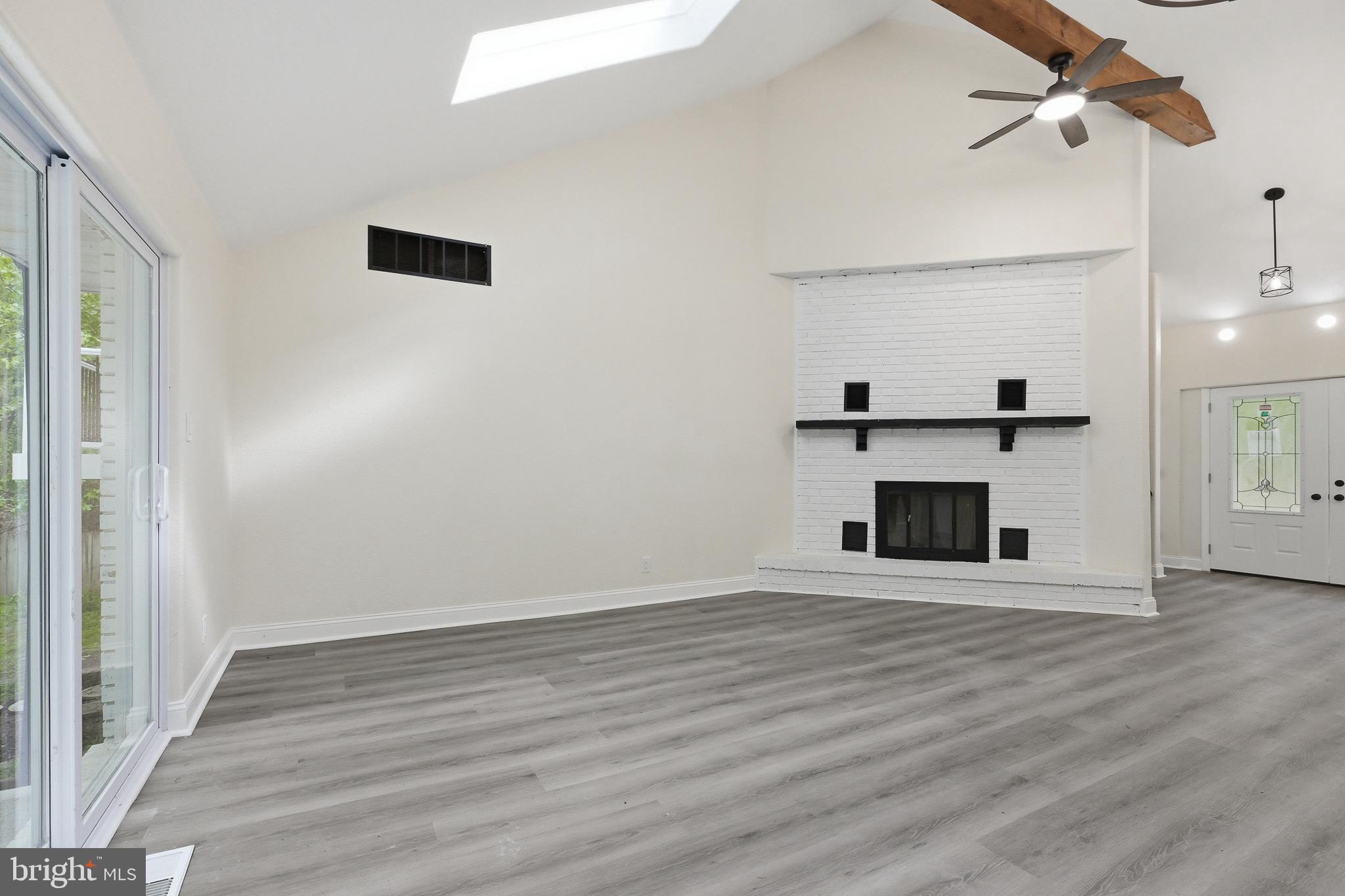 319 Pricketts Mill Road Tabernacle, NJ 08088 - Photo 7 of 29 an empty room with wooden floor fireplace and windows