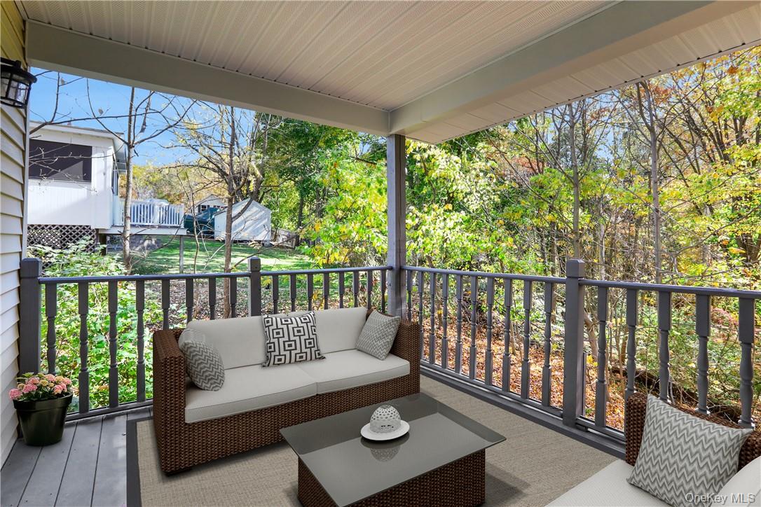 2 Requa Street Briarcliff Manor, NY 10510 - Photo 11 of 36 a balcony with furniture and wooden floor