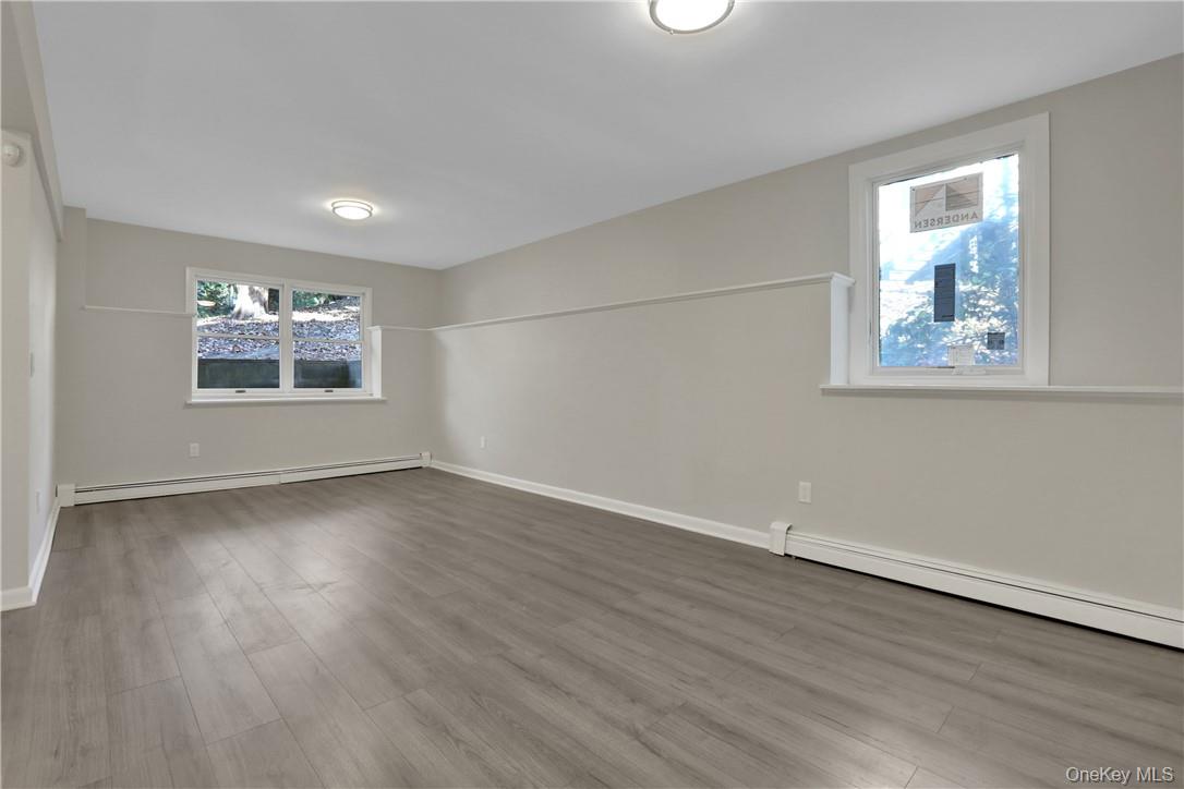 2 Requa Street Briarcliff Manor, NY 10510 - Photo 30 of 36 a view of an empty room with wooden floor and a window