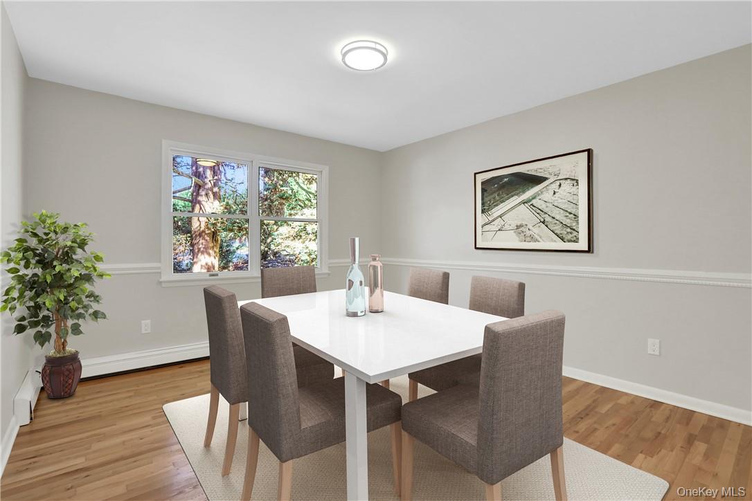 2 Requa Street Briarcliff Manor, NY 10510 - Photo 4 of 36 a view of a dining room with furniture window and wooden floor
