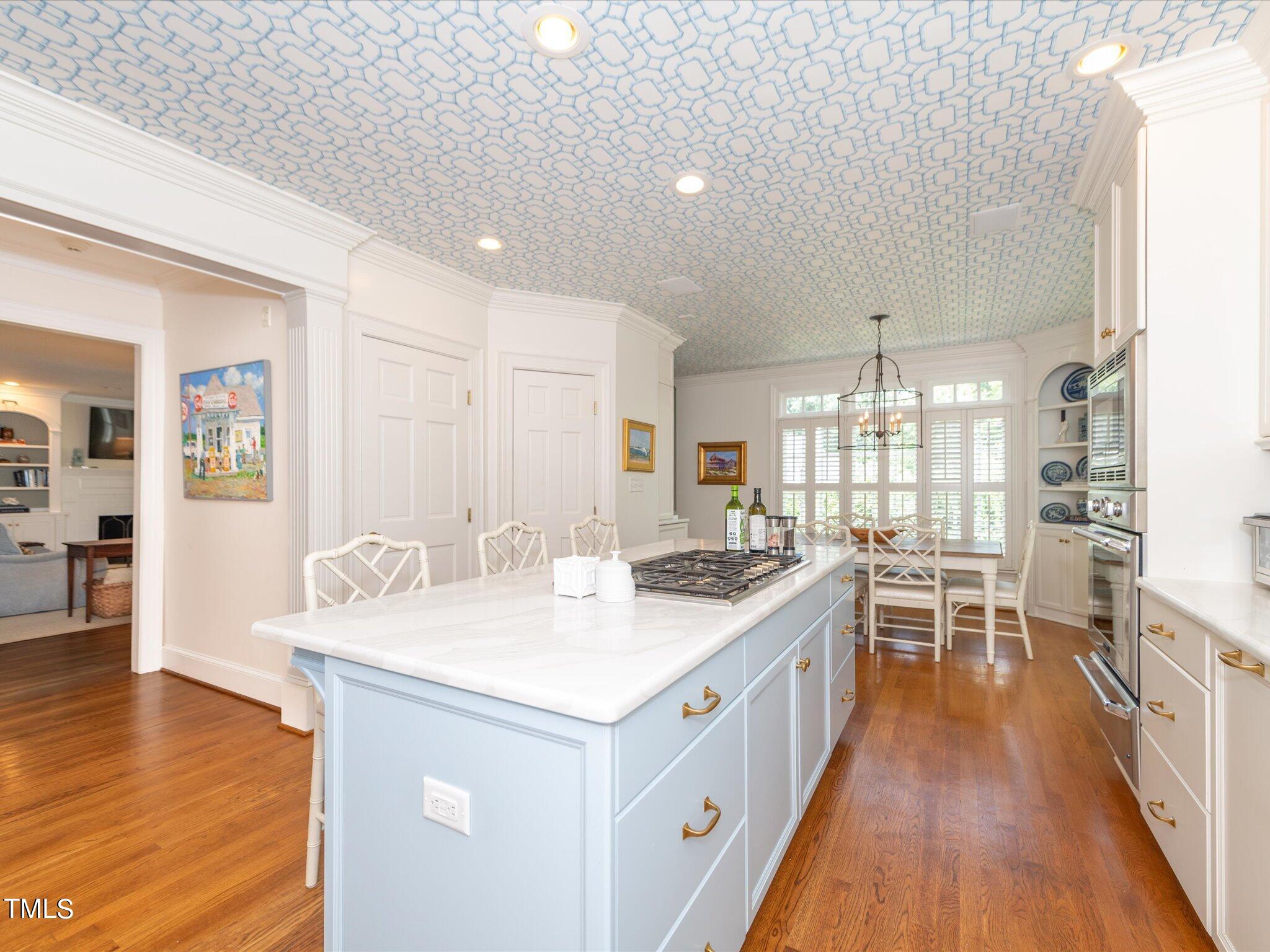 2622 Dover Road Raleigh, NC 27608 - Photo 17 of 72 a kitchen with a stove and wooden floor