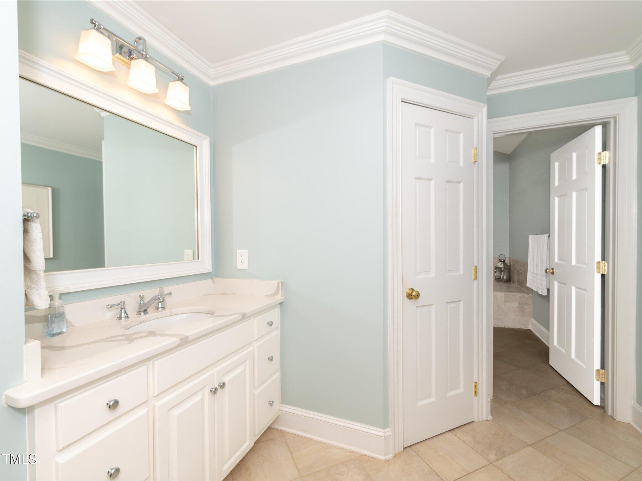 2622 Dover Road Raleigh, NC 27608 - Photo 50 of 72 a spacious bathroom with a double vanity sink mirror and