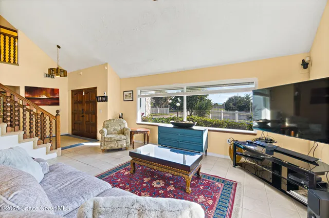 a bathroom with a granite countertop sink a toilet a mirror and shower