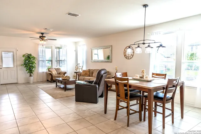 a dining room with furniture and window