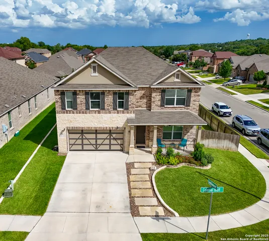 a aerial view of a house with a yard