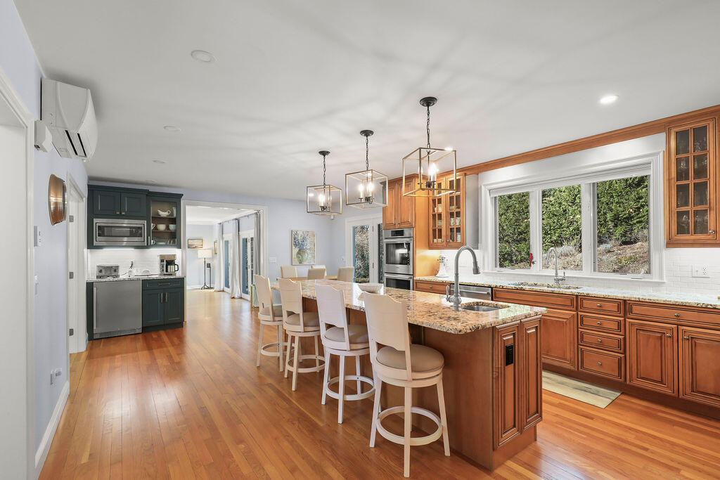5 Fairfield Drive East Sandwich, MA 02537 - Photo 21 of 72 a large kitchen with a table and chairs