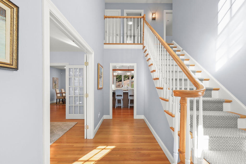 5 Fairfield Drive East Sandwich, MA 02537 - Photo 34 of 72 a view of staircase with lots of frames on wall and a window