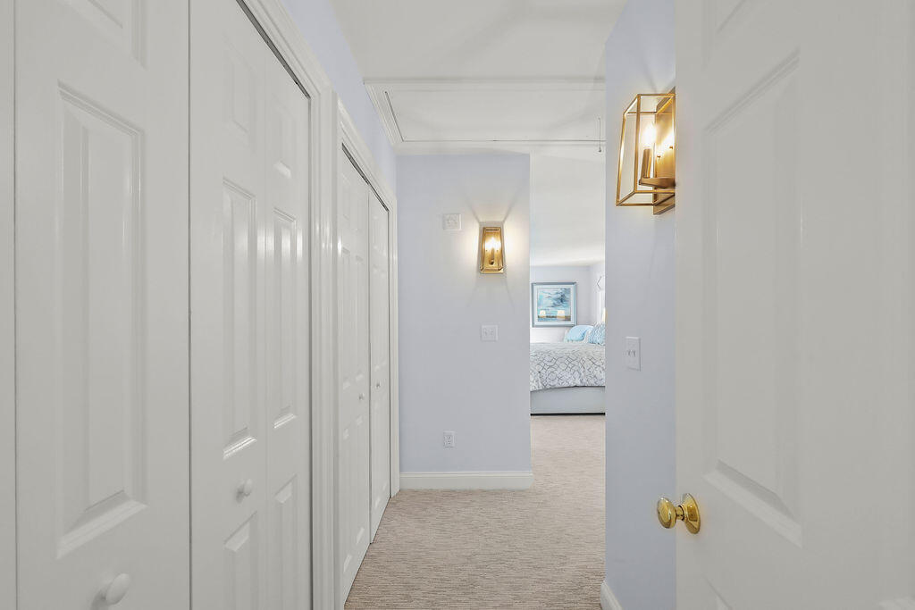 5 Fairfield Drive East Sandwich, MA 02537 - Photo 36 of 72 a view of a hallway with wooden floor and windows