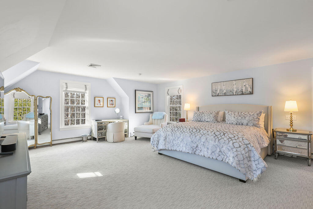 5 Fairfield Drive East Sandwich, MA 02537 - Photo 38 of 72 a spacious bedroom with a large bed and a couch