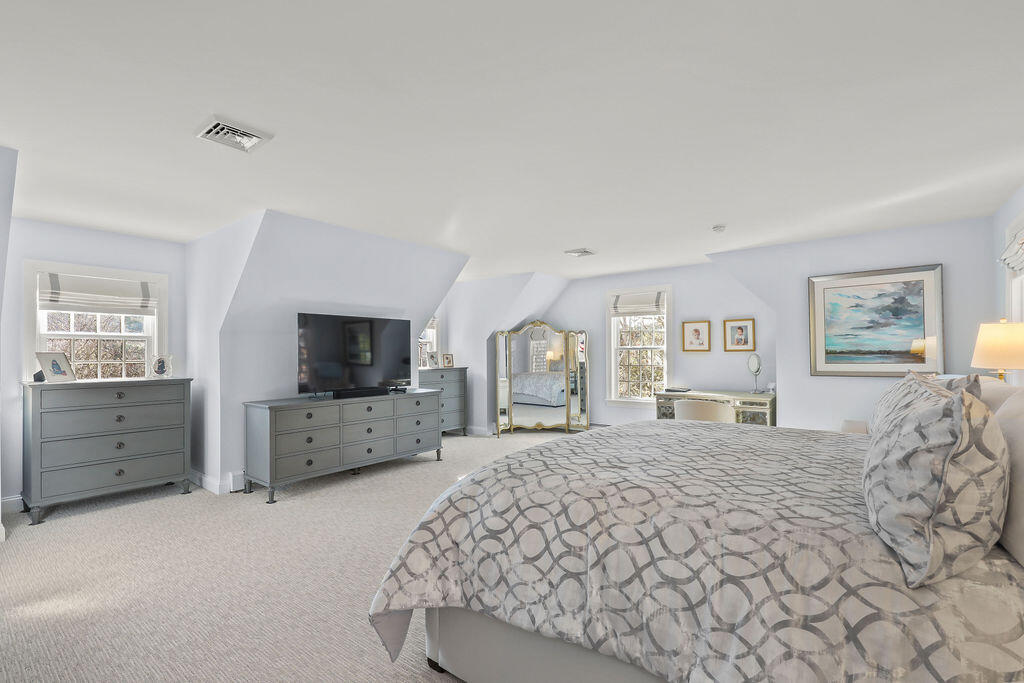 5 Fairfield Drive East Sandwich, MA 02537 - Photo 39 of 72 a large bedroom with a bed and a flat screen tv