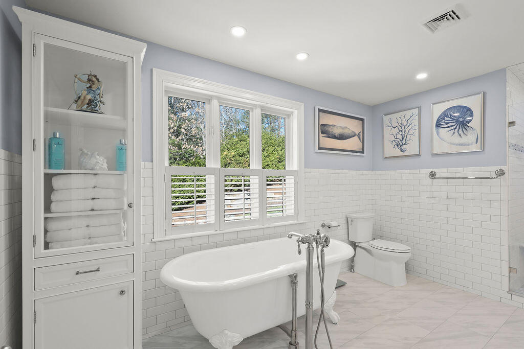 5 Fairfield Drive East Sandwich, MA 02537 - Photo 42 of 72 a spacious bathroom with a bathtub and a toilet
