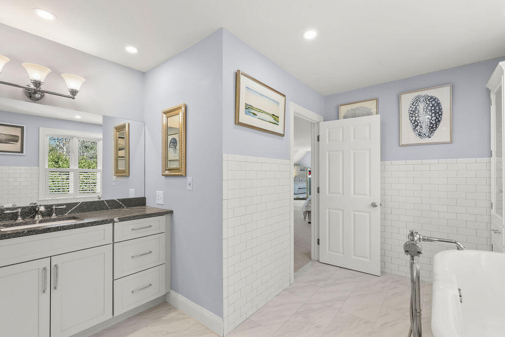 5 Fairfield Drive East Sandwich, MA 02537 - Photo 45 of 72 a spacious bathroom with a double vanity sink a mirror a shower and a window