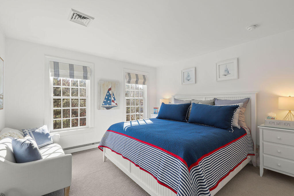 5 Fairfield Drive East Sandwich, MA 02537 - Photo 51 of 72 a bedroom with a bed and a couch