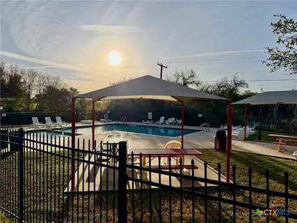 a view of a chairs and tables in the balcony