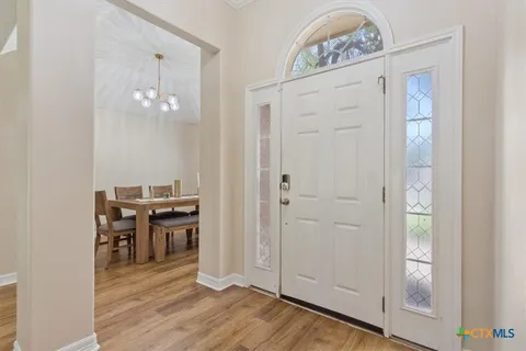 a view of a dining hall with wooden floor