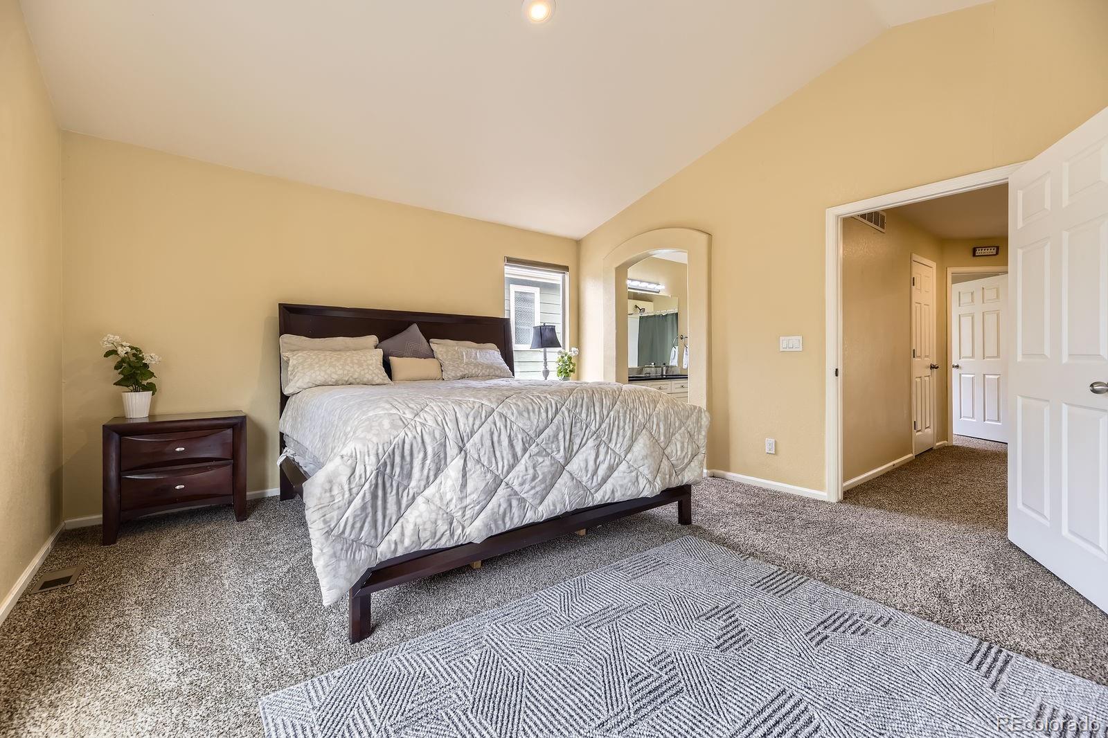 5329 Morning Glory Place Highlands Ranch, CO 80130 - Photo 15 of 28 a bedroom with a bed and a dresser