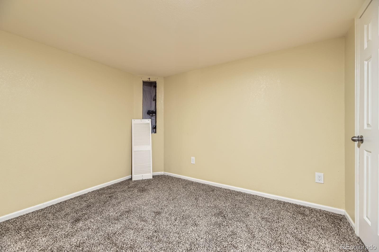 5329 Morning Glory Place Highlands Ranch, CO 80130 - Photo 22 of 28 an empty room with an entryway