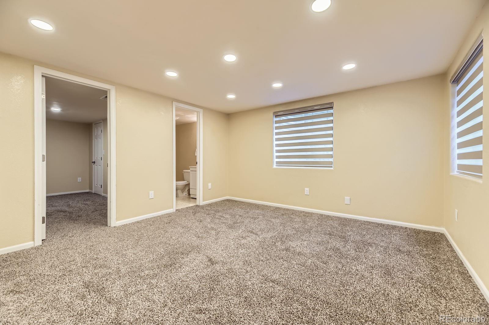 5329 Morning Glory Place Highlands Ranch, CO 80130 - Photo 24 of 28 an empty room with windows