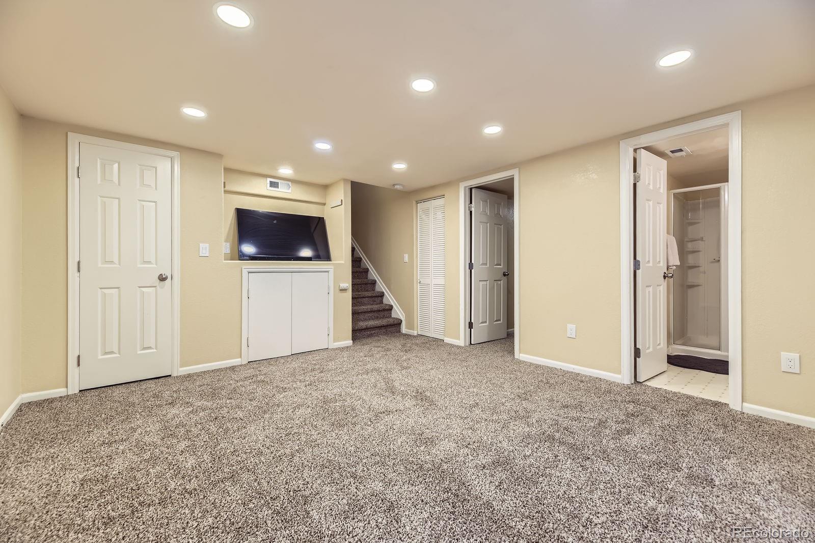 5329 Morning Glory Place Highlands Ranch, CO 80130 - Photo 25 of 28 a view of an empty room with a fireplace