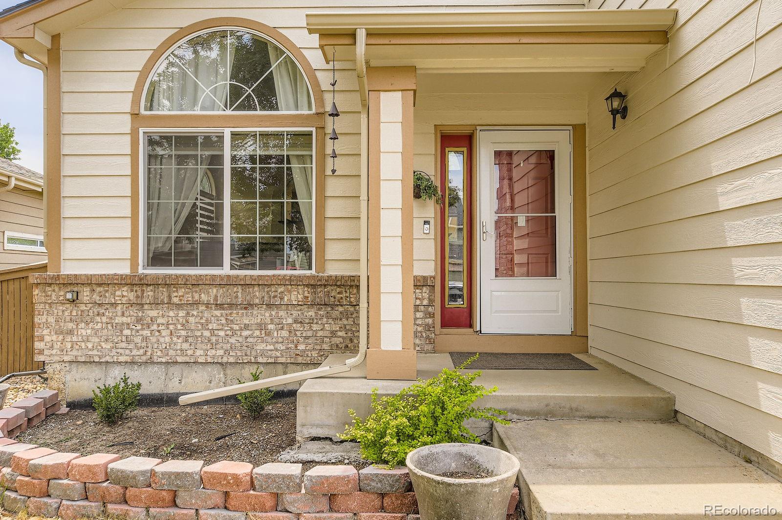 5329 Morning Glory Place Highlands Ranch, CO 80130 - Photo 4 of 28 a front view of a house