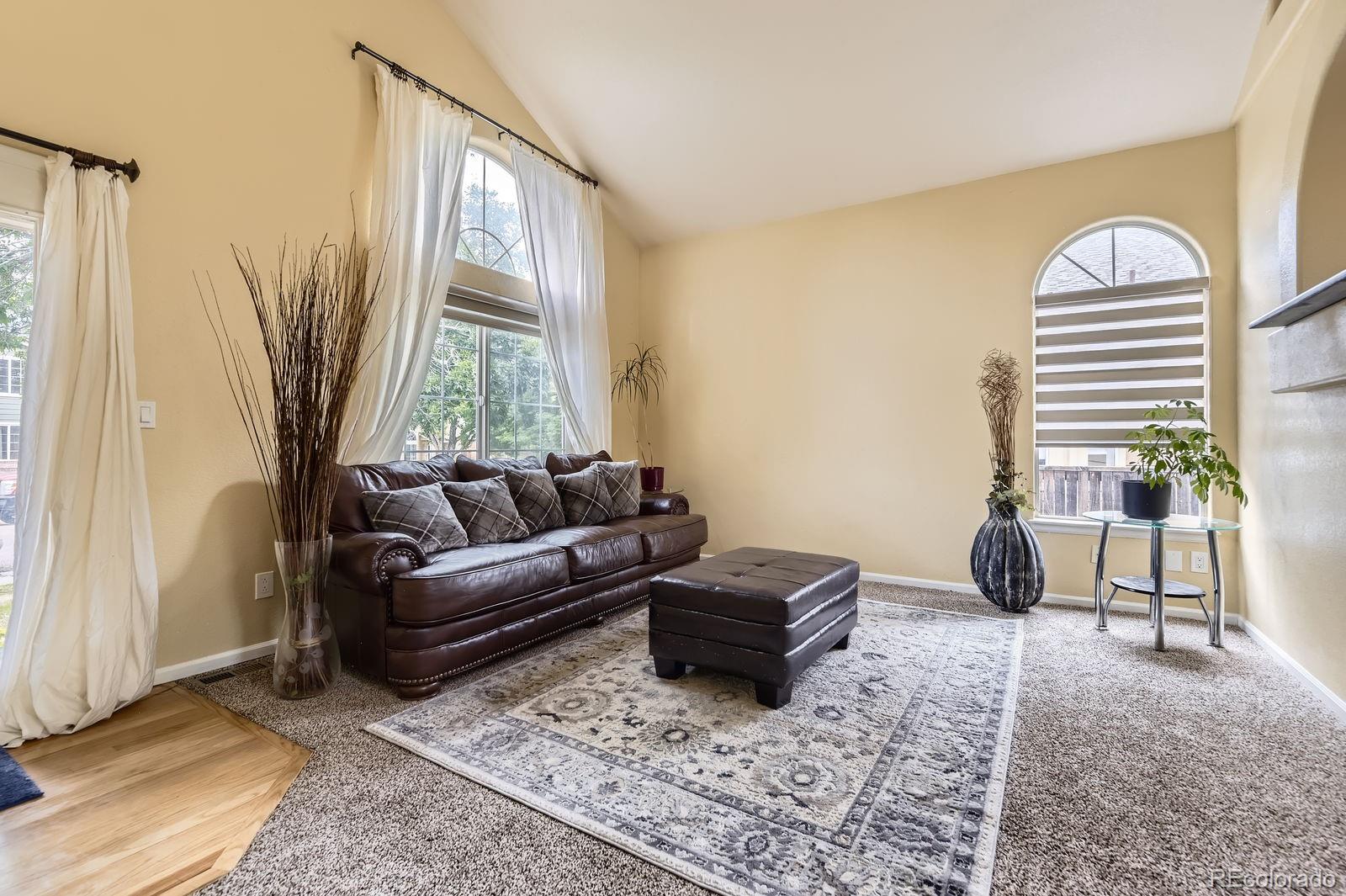 5329 Morning Glory Place Highlands Ranch, CO 80130 - Photo 5 of 28 a living room with furniture and a window