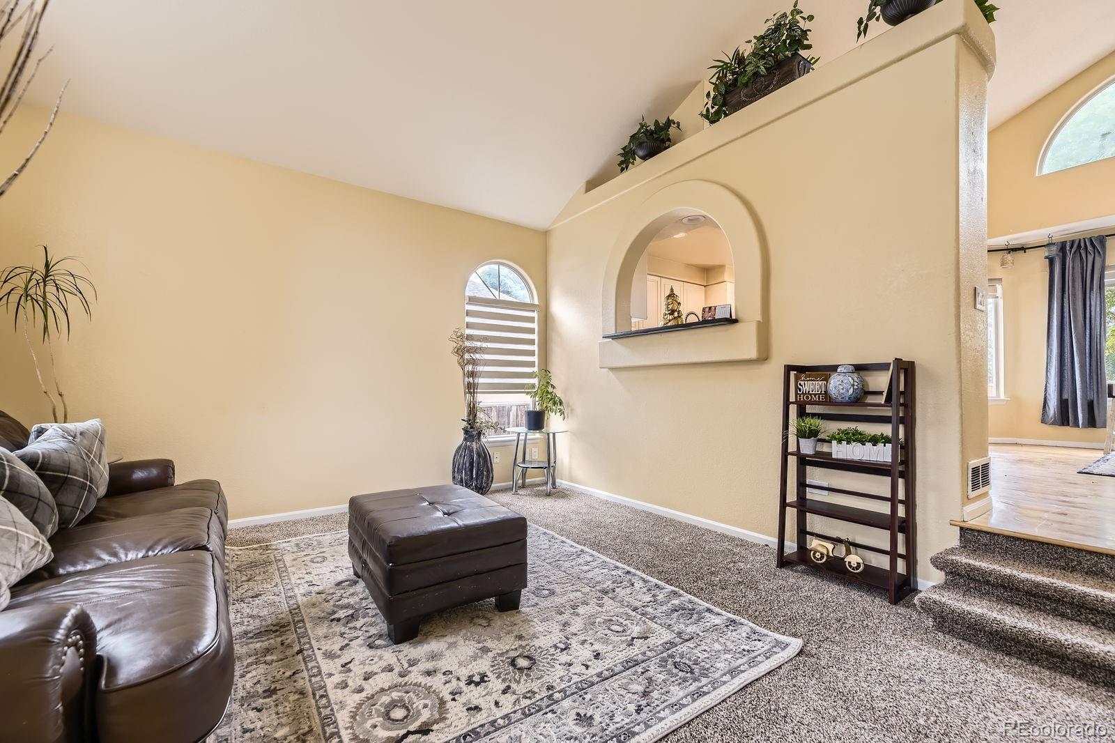 5329 Morning Glory Place Highlands Ranch, CO 80130 - Photo 7 of 28 a living room with furniture and a window