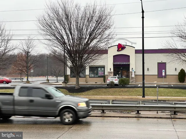 a view of a street with cars