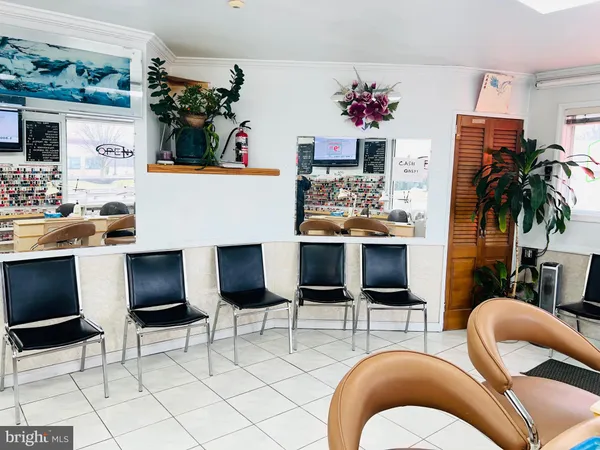 a living room with furniture and a gym machine