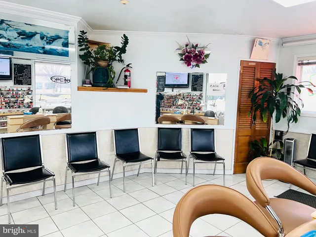 a living room with furniture and a gym machine