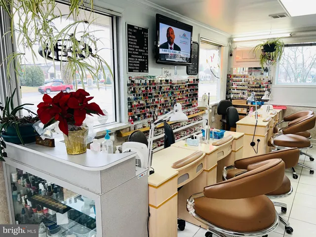 a room with furniture a flat screen tv and a floor to ceiling window