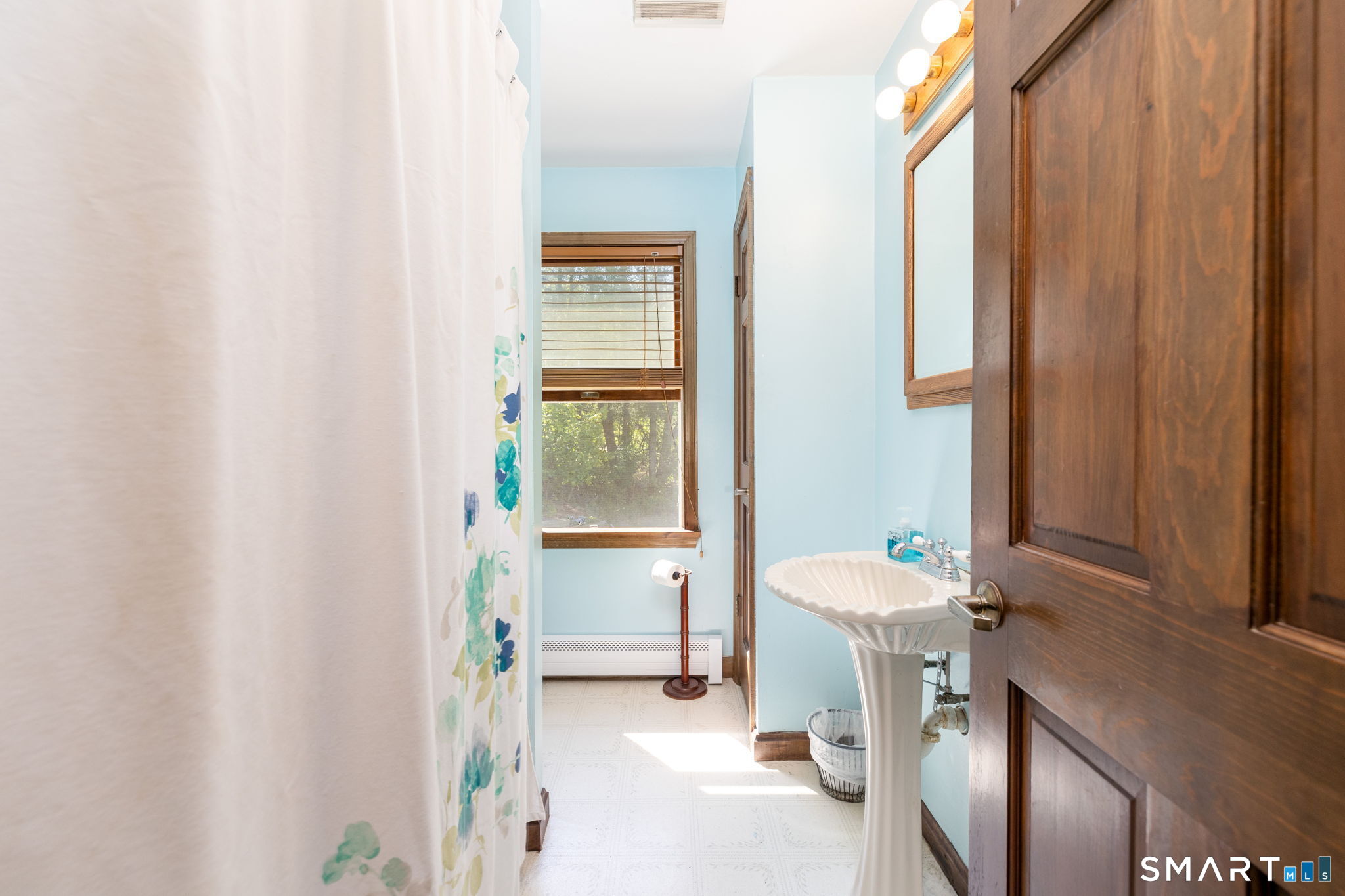 39 Chapman Road Marlborough, CT 06447 - Photo 18 of 40 a bath room with a sink and a bath tub