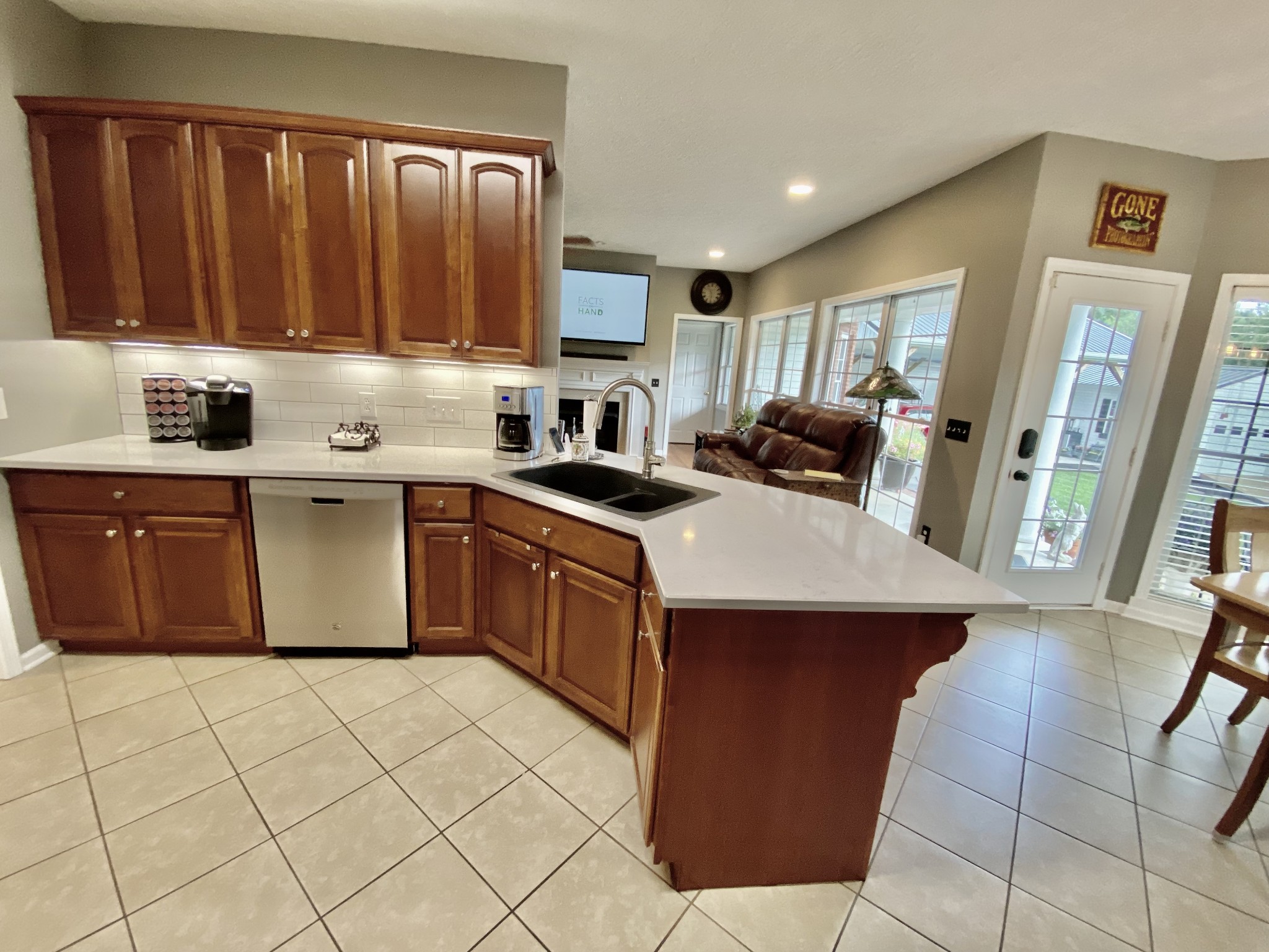 5704 Flewellyn Road Springfield, TN 37172 - Photo 14 of 34 a kitchen with stainless steel appliances granite countertop a sink counter space cabinets and a large window