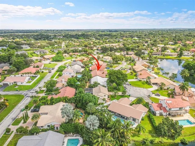 an aerial view of residential houses with outdoor space