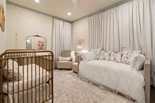 a bedroom with bed and a window