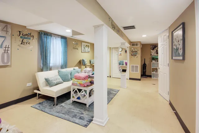a living room with furniture and a rug