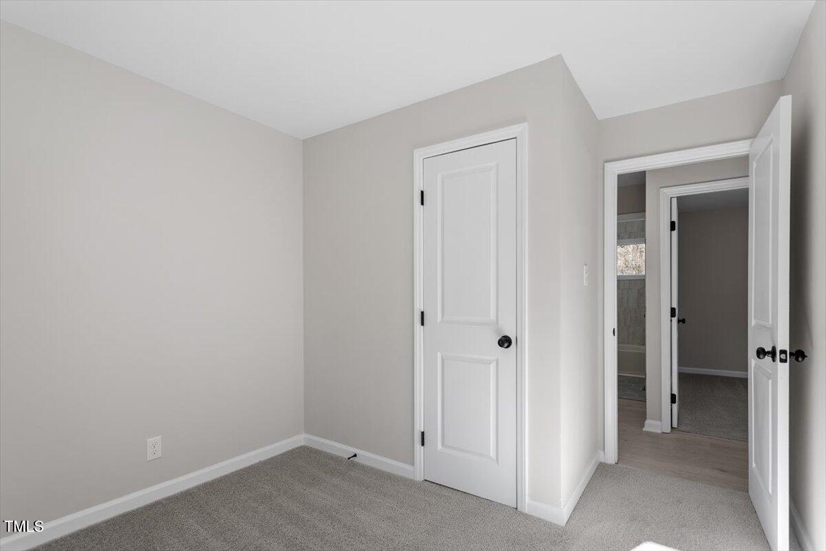 1404 Valley Road Garner, NC 27529 - Photo 14 of 29 an empty room with closet