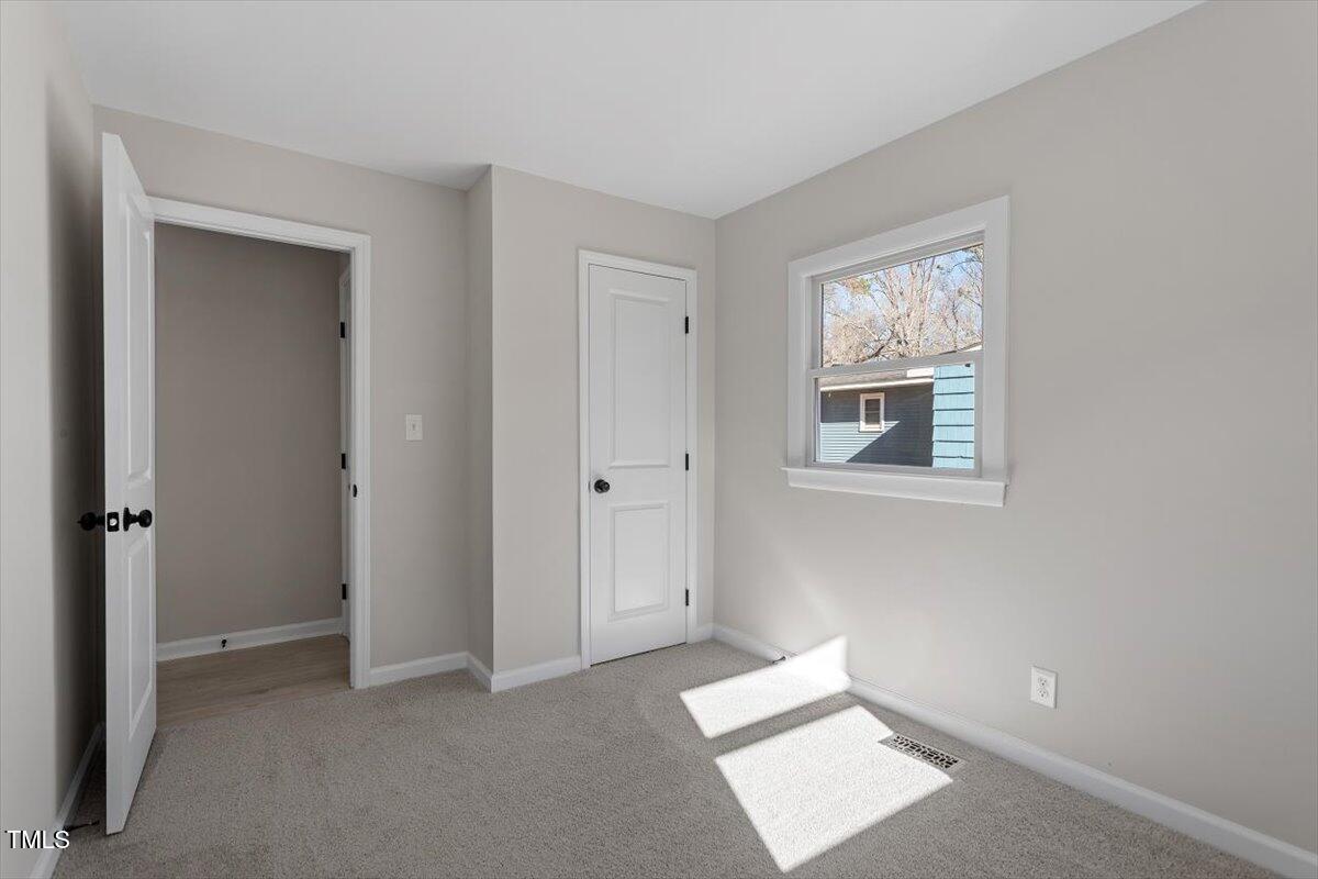 1404 Valley Road Garner, NC 27529 - Photo 17 of 29 a view of an empty room and window