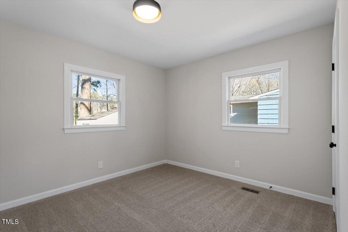 1404 Valley Road Garner, NC 27529 - Photo 19 of 29 an empty room with windows