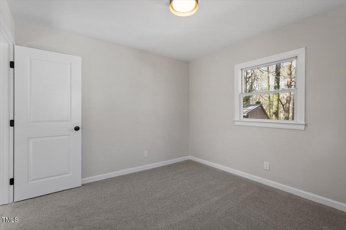 1404 Valley Road Garner, NC 27529 - Photo 21 of 29 an empty room with windows