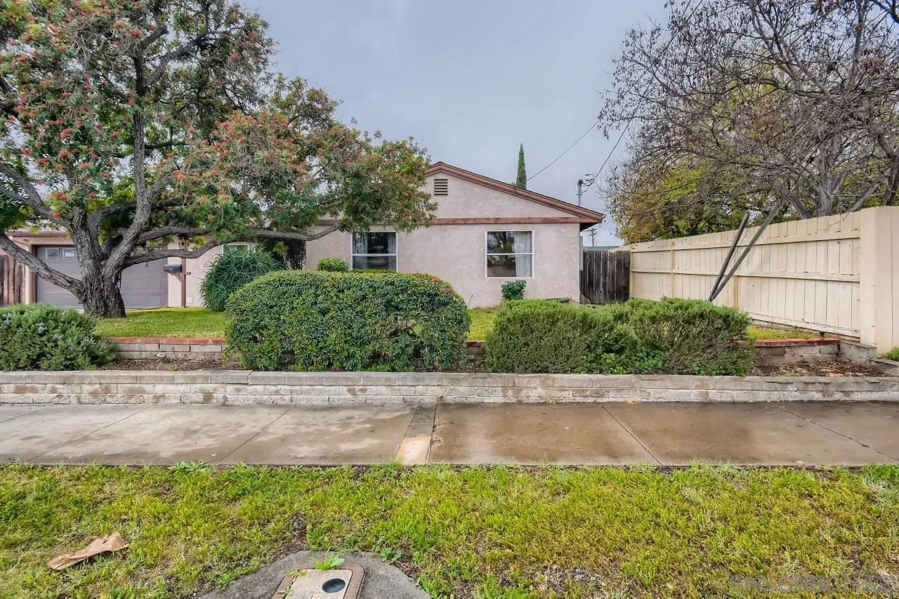 9572 Domer Road Santee, CA 92071 - Photo 1 of 28 a front view of a house with a yard