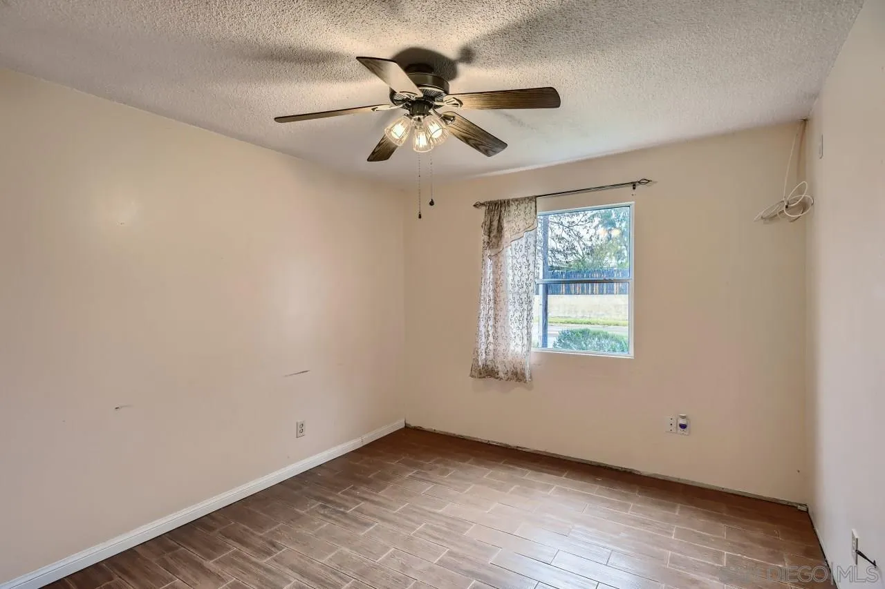 9572 Domer Road Santee, CA 92071 - Photo 18 of 28 a view of an empty room with a window