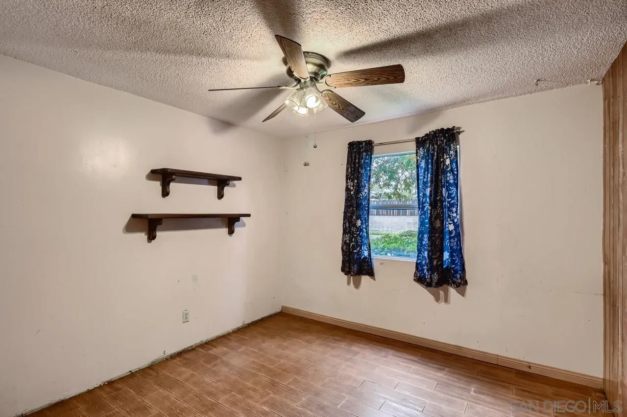 9572 Domer Road Santee, CA 92071 - Photo 20 of 28 an empty room with windows and fan