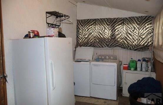11229 County Rd JJ 5 Manzanola, CO 81058 - Photo 32 of 32 a utility room with dryer and washer