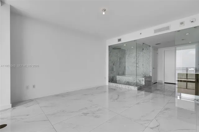 a spacious bathroom with a double vanity sink mirror and double