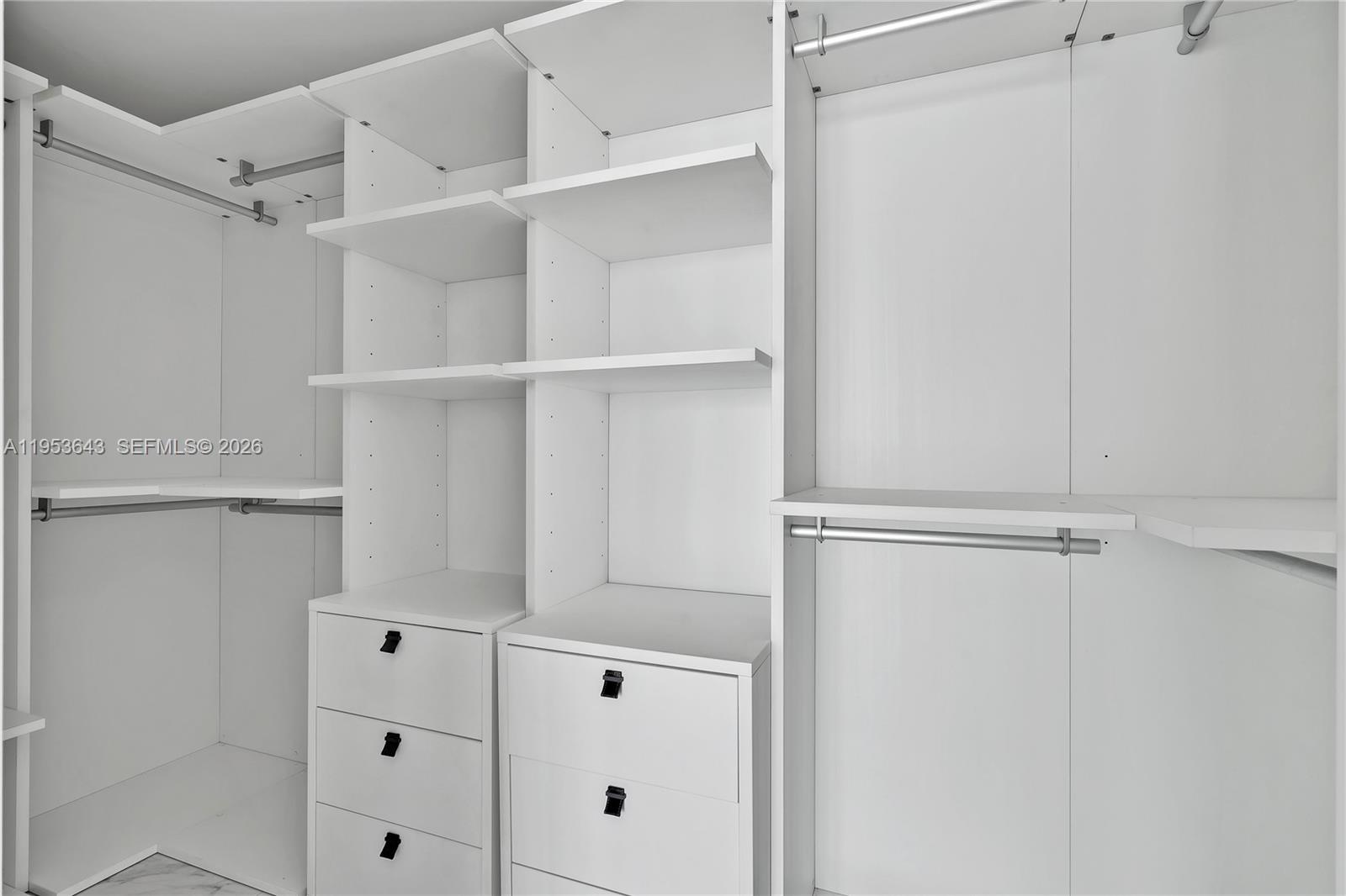 3131 Northeast 7th Avenue, Unit 3704 Miami, FL 33137 - Photo 29 of 61 a view of walk in closet with empty racks